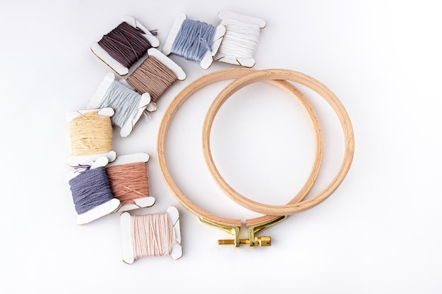 assorted embroidery threads and hoops